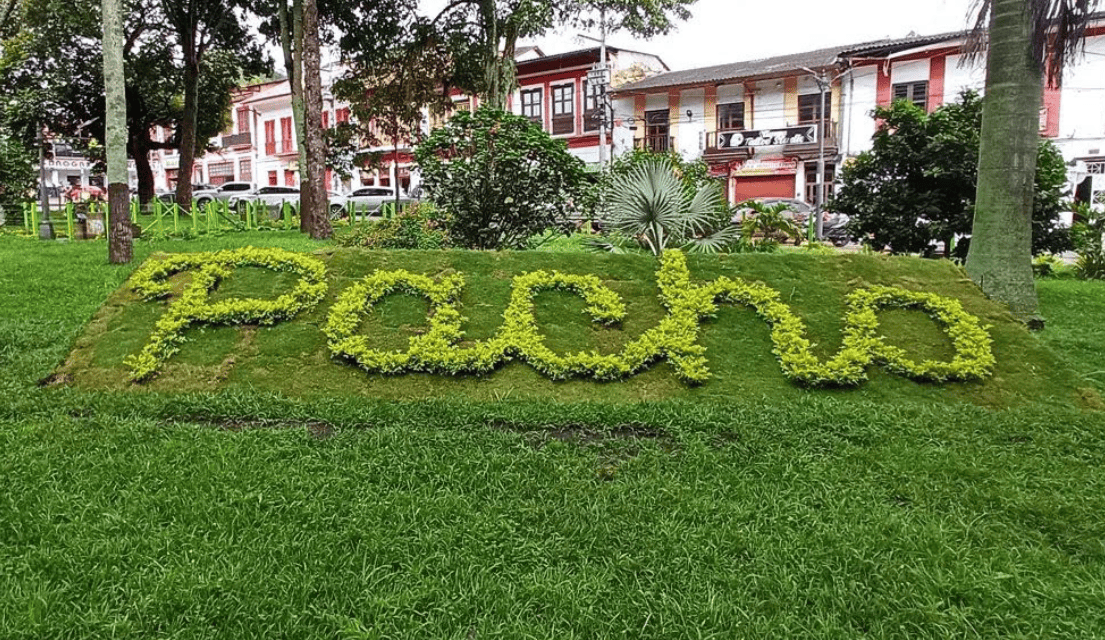 A beautiful park in Pacho with the word 'Pacho' spelled out in greenery.
